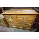 A 1.06m Edwardian satin walnut chest of two short and two long graduated drawers, set on plinth base