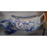 A 19th Century blue and white transfer printed pottery bourdaloue decorated with butterflies and