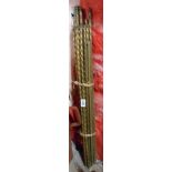 A quantity of Victorian brass stair rods of rope and candy twist form with flame twist terminals -