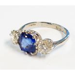 A marked PLAT ring, set with central 2.45ct. round cut sapphire and two brilliant cut diamonds - 1.