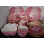 A 19th Century Wileman & Co. Aesthetic Movement part tea set decorated in pink with a transfer