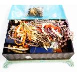A vintage ornate plastic casket containing assorted costume jewellery