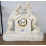 A vintage plaster cased timepiece with boy, dog and Take It Slowly text, with simple mechanical