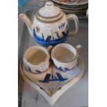 A Russian pottery St. Petersburg souvenir tea set for two comprising teapot, two cups on a heart