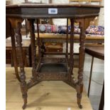 A 61cm Edwardian walnut octagonal topped occasional table, set on turned supports with fretwork