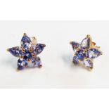 A pair of marked 9k tanzanite cluster star pattern ear-rings
