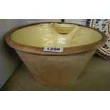 An antique slipware wash basin with applied soap holder - probably North Devon