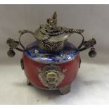 A 20th Century Chinese hardstone vessel with cloisonne collar and metal mounts, the lid with