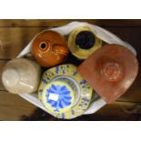 A bag containing a modern Chinese porcelain ginger jar, two stone hot water bottles, money box,