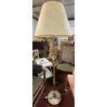 A vintage brassed metal and onyx standard lamp with shade