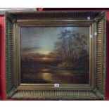 An ornate gilt framed oil on canvas, depicting a moonlit river landscape - unsigned - 49cm X 60cm