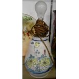 A Honiton pottery lamp base decorated with floral sprays and a blue dash rim