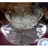 A large vintage pressed glass punch bowl, cups and stand