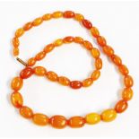 A vintage honey amber graduated bead necklace