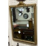 A vintage small gilt framed bevelled oblong wall mirror