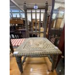 An antique bobbin turned framed child's chair with remains of rattan seat panel - sold with a simple