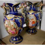 A pair of Continental majolica vases decorated with central panels depicting Watteau scenes