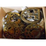 A box containing a small quantity of horse brasses - sold with a vintage John Peel form door