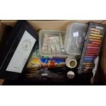 A box containing a quantity of artist's accessories including oil paints, pastels, palettes, etc.