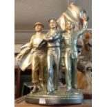 An Art Deco style plaster figurine of WWII interest depicting a soldier, sailor and airman