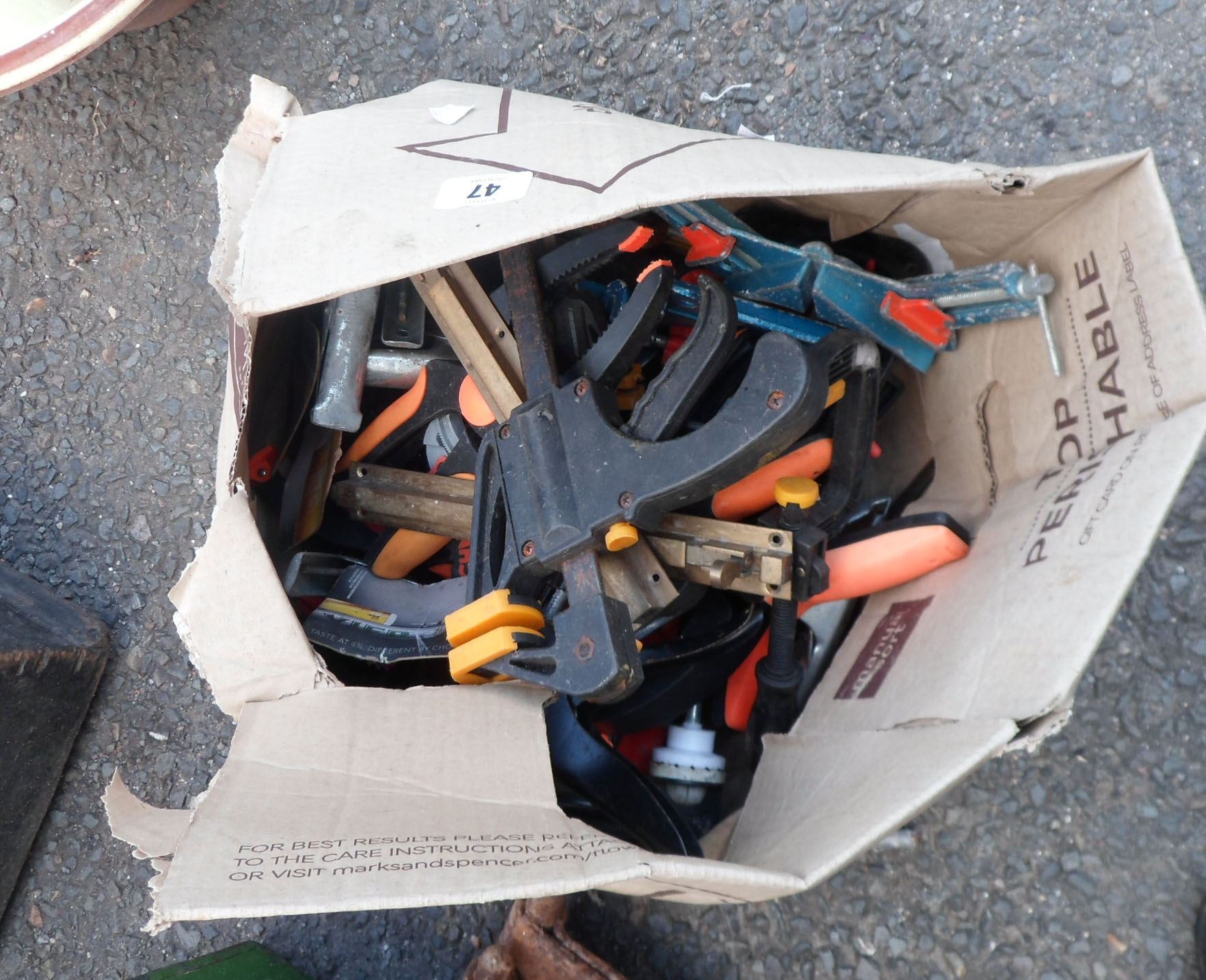 A box of clamps including G clamps, JCB & Roughneck examples, etc.