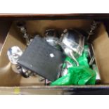 A box containing a quantity of silver plated items including teaware, candlesticks and cutlery,