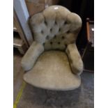 A Victorian button back chair with later upholstery