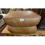 A vintage brown leatherette upholstered pouffe with central cord binding