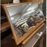 A retro teak effect mounted slope fronted dressing table mirror