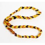 A chevron cut coloured amber bead necklace