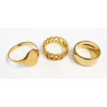 Three 9ct. gold rings comprising a blank signet ring, wedding band and pierced band