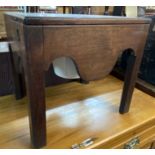 A 19th Century mahogany commode with liner and shaped apron, set on chamfered square legs