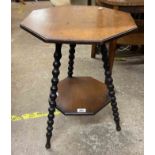 A late Victorian stained wood two tier table with octagonal surfaces, set on bobbin turned supports