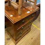 A 46cm reprodution mahogany chest of four long drawers, set on bracket feet