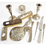 A quantity of assorted silver dressing table items including pair of candlesticks, brushes and jars,