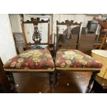 A pair of Edwardian decorative inlaid walnut framed boudoir chairs with harebell spalts and