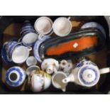 A box containing assorted ceramic items including a Leaper Newlyn dish, blue and white cups and