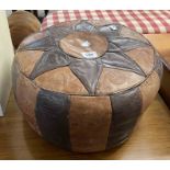 A vintage North African stitched leather pouffe with impressed decoration