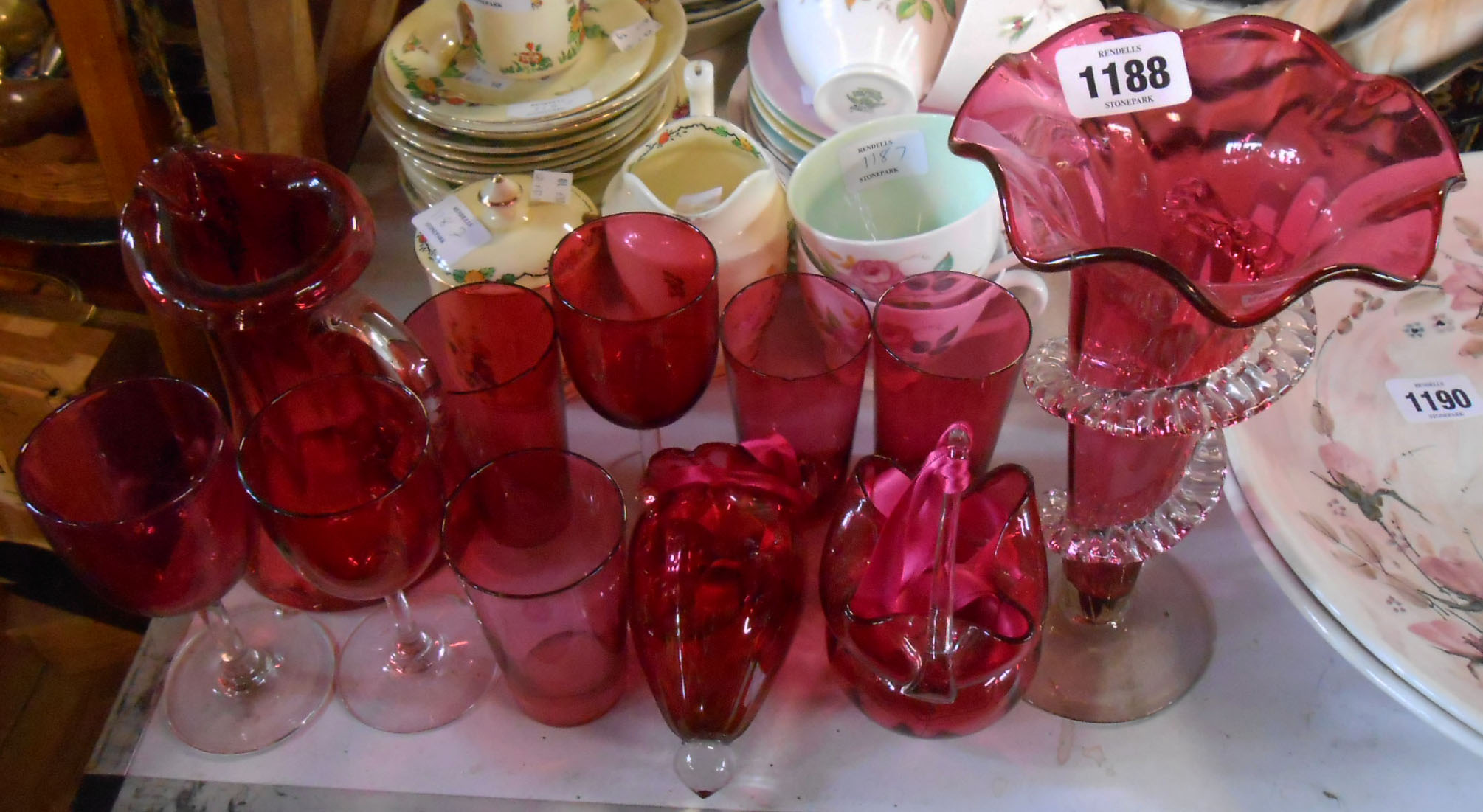 A selection of cranberry glassware including wine glasses, tumblers, jugs, etc. - various condition