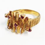 A 9ct. gold bark effect ring with tiny rubies