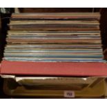 A box containing mostly classical music LP records