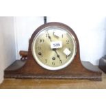 A vintage oak cased Napoleon hat mantle clock with eight day chiming movement