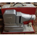 A vintage Gnome slide projector in case