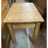 A waxed pine coffee table, set on square legs