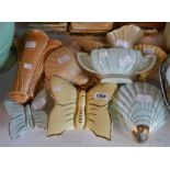 Eight Art Deco pottery wall pockets of various styles and shapes including Clarice Cliff shell form,