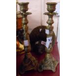 A pair of early 20th Century decorative cast brass candlesticks with Rococo styling