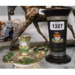 An early 19th Century bone china chamber candlestick in the Derby manner decorated with moulded