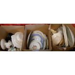 Three boxes containing assorted ceramic items including plates, jugs, mugs, etc.