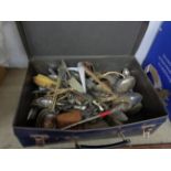 A case containing assorted silver plated cutlery and a silver handled button hook, etc.
