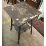 An early 20th Century stained wood two tier occasional table, set on turned supports